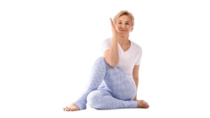 Woman doing postures as part of morning routine